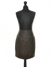 Load image into Gallery viewer, A brown leather midi skirt with decorative stitchings, displayed on a mannequin.