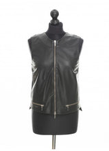 Load image into Gallery viewer, Black color sheep leather sleeveless blouse with perforations at the front, a regular neckline, and a zipper at the front, two pocket imitation. Displayed on a mannequin.