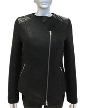 Load image into Gallery viewer, Black jacket with leather accents on a mannequin against a white background