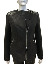 Load image into Gallery viewer, Black jacket with leather shoulder panels on a mannequin against a white background
