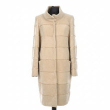Įkelti nuotrauką į galerijos peržiūros programą, Beige long sheepskin fur coat with decorative textile inserts, featuring a stand collar, front pockets, and lining inside.