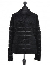 Load image into Gallery viewer, Black sheepskin fur short jacket with textile inserts and a fur hooks fastening, displayed on a mannequin.