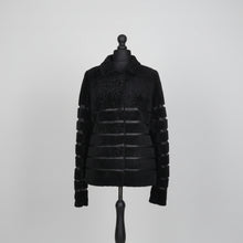 Įkelti nuotrauką į galerijos peržiūros programą, Black sheepskin fur short jacket with textile inserts and a fur hooks fastening, displayed on a mannequin.