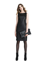 Load image into Gallery viewer, Woman wearing a black dress holding a matching clutch on a white background
