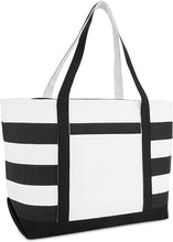 Load image into Gallery viewer, A black and white striped cotton handbag with a full zip closure and an external pocket with no fastening. It appears to be spacious and is displayed in a way that suggests versatility for shopping, beach, or sports use.
