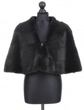 Load image into Gallery viewer, A dark brown mahogany-colored rabbit fur cloak with a free silhouette, displayed on a mannequin. It features a lining inside and fur hook fastening.