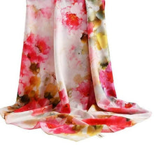 Load image into Gallery viewer, A floral patterned silk scarf displayed elegantly with a focus on its soft texture and vibrant colors.