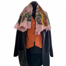Load image into Gallery viewer, A brown wool cocoon style midi length cardigan with leather trim and press-studs fastening, lined inside, displayed on a mannequin with a pink floral scarf and an orange jacket.