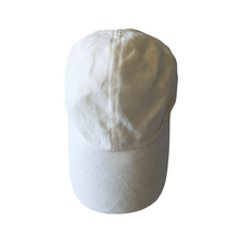Load image into Gallery viewer, A white unisex baseball cap made of linen, with a closed back and adjustable head width.