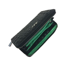 Load image into Gallery viewer, A black croco patterned leather wallet for women with visible green lining and a zipper closure.