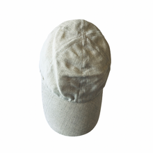 Load image into Gallery viewer, A light beige linen sports cap with an adjustable snap closure.