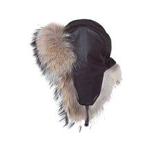 Load image into Gallery viewer, A cap made of brown leather with raccoon fur trim, featuring a trapper style with adjustable wearing possibilities and a soft lining inside.