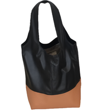 Load image into Gallery viewer, A bicolor leather handbag with cognac brown and black colors, featuring two shoulder straps and a zippered pocket.
