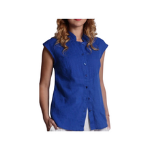 Load image into Gallery viewer, A woman wearing a blue, sleeveless, button-up linen blouse with decorative seams and a collar.