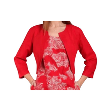 Load image into Gallery viewer, A woman wearing a red linen jacket with 3/4 length sleeves and decorative seams, paired with a floral print dress.