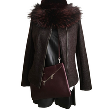 Load image into Gallery viewer, A black color sheep leather and textile jacket with a waterproof dark brown to black stretch wool collar, featuring a fitted silhouette, hip length, and two-way zipping closure. Front pockets with zipping are visible, and the jacket appears to have an elastic lining.