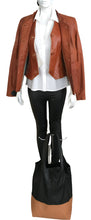 Load image into Gallery viewer, Mannequin wearing a brown leather jacket, white shirt, black pants, and carrying a black and brown handbag.