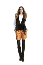 Load image into Gallery viewer, Woman wearing a black vest, white shirt, orange shorts, and black boots on a white background