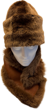 Load image into Gallery viewer, A brown sheepskin fur cap on a mannequin head, displaying the cap's soft fur design and its lining.