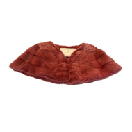 A raspberry  red mink bolero jacket with colourful lining and fur hook fastening at the front on a white background.