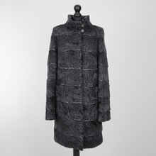 Įkelti nuotrauką į galerijos peržiūros programą, A black textured faux fur coat with horizontal quilted panel details and a high collar, displayed on a black mannequin against a light gray background.
