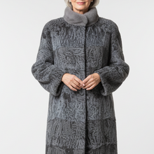 Įkelti nuotrauką į galerijos peržiūros programą, A woman modeling a long gray faux-fur coat with a high collar and front button closure, paired with black ankle boots, against a light gray studio background.
