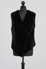Įkelti nuotrauką į galerijos peržiūros programą, A black faux fur wrap vest displayed on a black mannequin torso against a light gray studio background.
