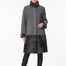 Įkelti nuotrauką į galerijos peržiūros programą, A model wearing a gray coat with a high dark gray faux-fur collar and hem, paired with black leather boots, shot against a plain white studio background.
