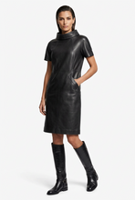Load image into Gallery viewer, Elegant Vilniaus Kailiai dress in soft fabric with a fitted waist and flowing skirt, shown on a hanger.
