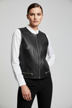 Load image into Gallery viewer, A woman modeling a black perforated faux-leather vest over a white collared shirt and black pants, photographed against a light gray studio background.
