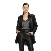 Load image into Gallery viewer, A woman modeling a black textured leather jacket over a black satin top and black faux-leather pants, standing against a solid white background.
