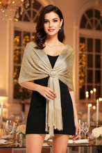 Load image into Gallery viewer, Woman wearing a gold shawl with a brooch in an elegant indoor setting
