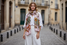 Įkelti nuotrauką į galerijos peržiūros programą, Woman wearing a colorful scarf and white outfit on a street.
