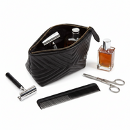 Leather cosmetic bag for men and women by Vilniaus Kailiai, model DS-ASL-7851, with a sleek, compact design and zipper closure.