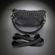Load image into Gallery viewer, Black woven handbag with a strap on a gray background
