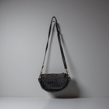 Load image into Gallery viewer, Black woven handbag with a strap on a gray background
