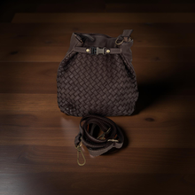 Load image into Gallery viewer, Brown woven bag with a strap on a wooden surface
