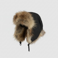 Black winter hat with fur trim on a light gray background