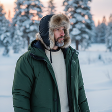 Load image into Gallery viewer, Black leather hat with faux fur trim, unisex design by Vilniaus Kailiai, featuring a stylish and warm winter accessory.
