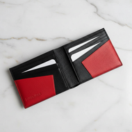 Black and orange leather men's wallet by Vilniaus Kailiai with a sleek design and multiple card slots.
