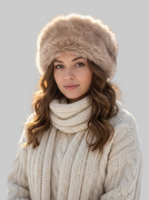 Įkelti nuotrauką į galerijos peržiūros programą, Vilniaus Kailiai Mod. URTE hat worn by a woman, showcasing stylish knit hat with ear warmer detail.
