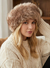 Įkelti nuotrauką į galerijos peržiūros programą, Vilniaus Kailiai Mod. URTE hat worn by a woman, showcasing stylish knit design and cozy winter accessory.
