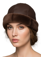 Woman wearing a brown fur hat against a gray background