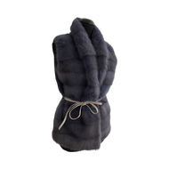 A violet dyed mink fur vest with a stand collar, lining, and front fur hook fastening, displayed on a mannequin.