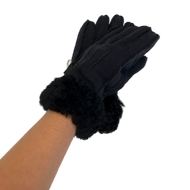 A pair of navy blue sheepskin gloves with decorative seams and a furry cuff, designed for women.