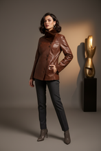 Įkelti nuotrauką į galerijos peržiūros programą, Vilniaus Kailiai Mod. 08657xxx jacket in black with a front zipper and high collar, displayed on a hanger.
