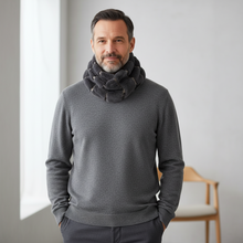 Load image into Gallery viewer, Man wearing a gray sweater and dark gray scarf in a minimalistic room.
