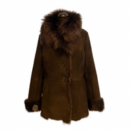 A brown sheepskin leather jacket with a wide collar and long sleeves, featuring a fur lining at the cuffs.