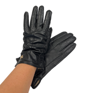 A pair of black leather gloves for women, displayed in a manner that showcases the fit and design.