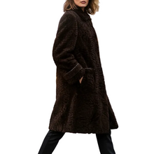 Įkelti nuotrauką į galerijos peržiūros programą, A woman wearing a dark brown textured faux-fur coat, black pants, and black high-heeled boots, walking against a solid white background.
